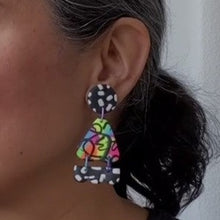 Load image into Gallery viewer, A video still of Vicky from Pink Lime Mango modelling handcrafted Neon Moth Fringe earrings for size reference. Bright, bold and colourful earrings made in Bristol UK
