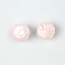 Load image into Gallery viewer, handcrafted bubble-gum pink resin statement studs. They contain the most amazing aurora glitter flakes. Colour changing iridescent pieces which shine when they catch the light. The earrings posts are made of sterling silver.
