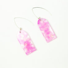 Load image into Gallery viewer, Delicate arches of clear resin with bursts of pale pink and tiny shimmery flower sequins. The unique V shaped earring hooks are made of sterling silver. Side view
