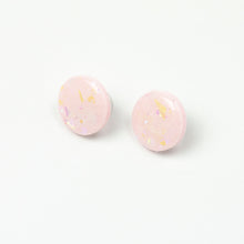 Load image into Gallery viewer, handcrafted bubble-gum pink resin statement studs. They contain the most amazing aurora glitter flakes. Colour changing iridescent pieces which shine when they catch the light. The earrings posts are made of sterling silver.
