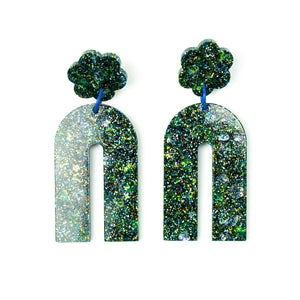 Front view. Handcrafted resin arch earrings that are jam packed with sparkly teal blue, green and gold glitter! These beauties have flower stud tops and look fabulous on!