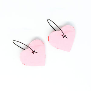 The backs of the pink and red heart hoops