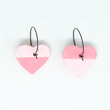 Load image into Gallery viewer, Bright, bold and colourful handcrafted earrings from Pink Lime Mango. Split Heart Hoops. One half is pale pink, and the other half is a lighter pink with tiny red hearts.

