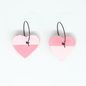 Bright, bold and colourful handcrafted earrings from Pink Lime Mango. Split Heart Hoops. One half is pale pink, and the other half is a lighter pink with tiny red hearts.