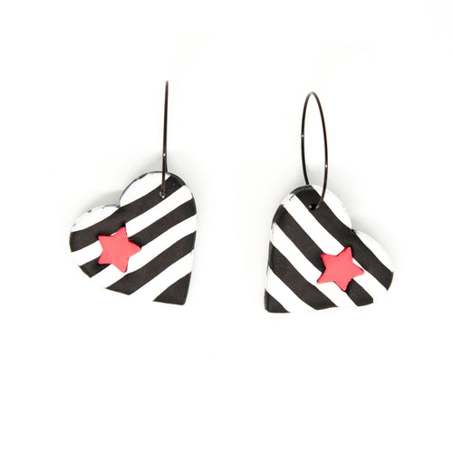 The cut out star shape in the striped heart is carefully filled in with a contrasting pink star! Contemporary and lightweight statement earrings. Handmade in Bristol, UK