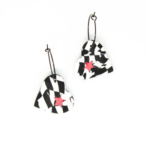 The cut out star shape in the striped heart is carefully filled in with a contrasting pink star! Contemporary and lightweight statement earrings. Handmade in Bristol, UK