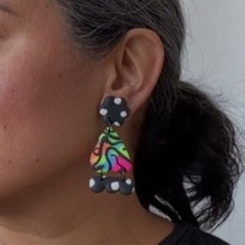 Load image into Gallery viewer, A video still of Vicky from Pink Lime Mango modelling handcrafted Super Neon Sisters earrings for size reference. Bright, bold and colourful earrings made in Bristol UK
